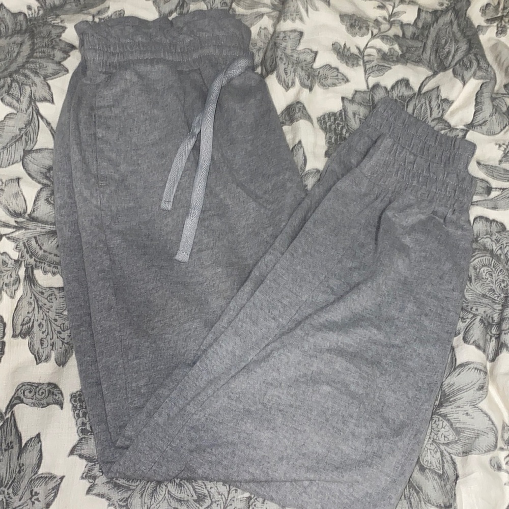 Grey Sweatpants. Frilled Top.